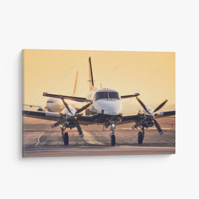 Leinwandbild zweimotoriges turboprop auf dem goldenen flugfeld