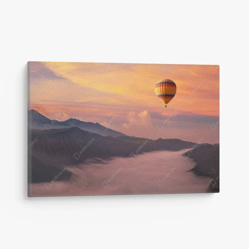 Leinwandbild heißluftballon über nebligen bergen bei sonnenaufgang