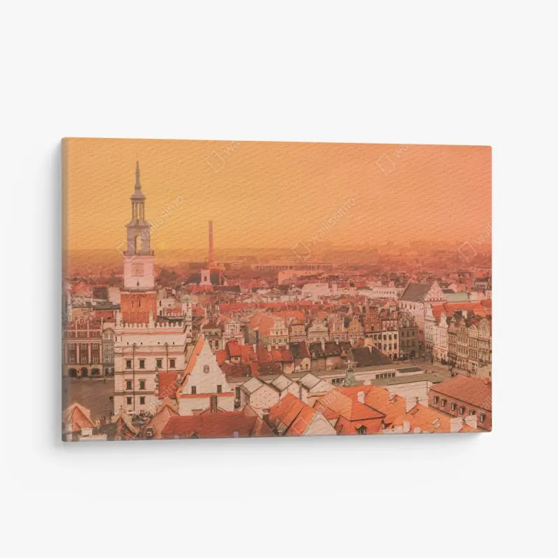 Leinwandbild warmer sonnenuntergang über historischen stadtdächern