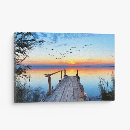 Leinwandbild steg bei sonnenuntergang über ruhigem see – Pixers®