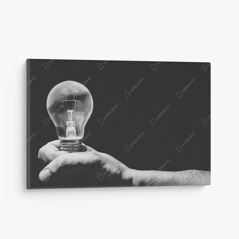 Leinwandbild monochrome hand hält glühbirne
