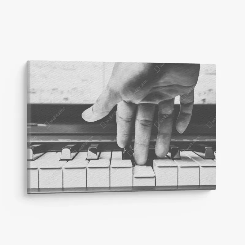 Leinwandbild hand auf klaviertasten