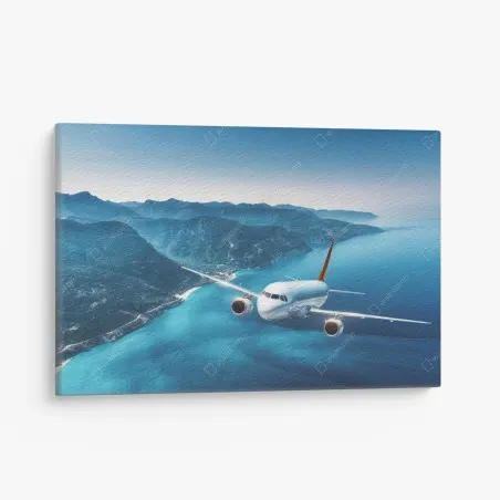 Leinwandbild küstenflug über türkisblauem meer – Pixers®