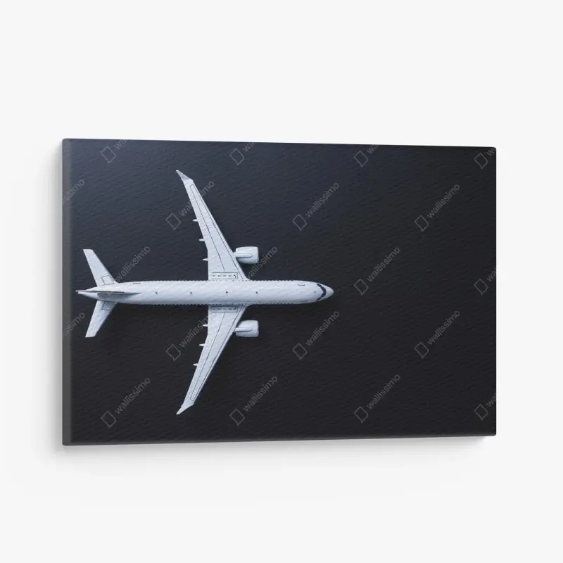 Leinwandbild weißes flugzeug von oben auf schwarzem hintergrund
