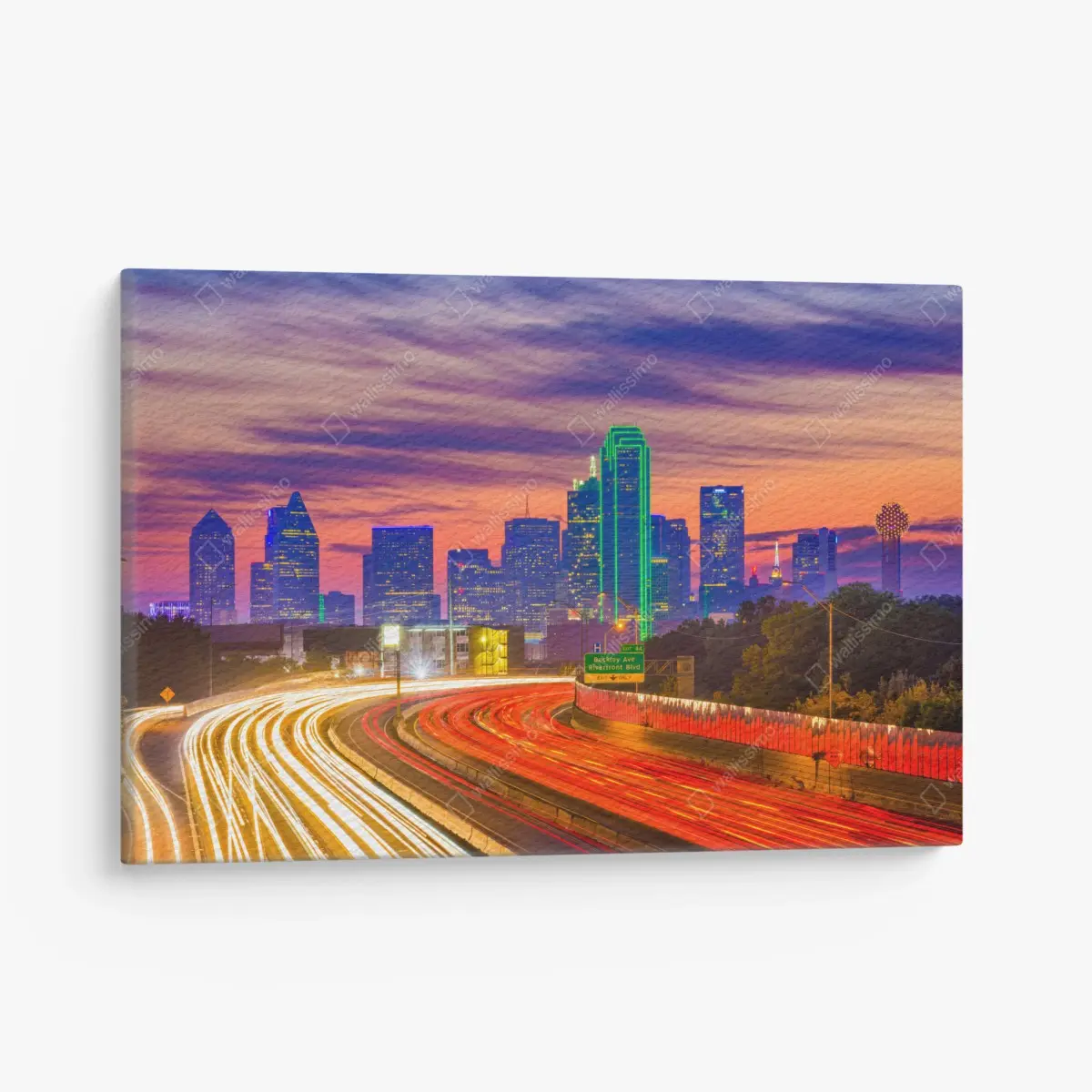 Leinwandbild panorama von Dallas bei sonnenuntergang mit lichtspuren auf der autobahn – Pixers®