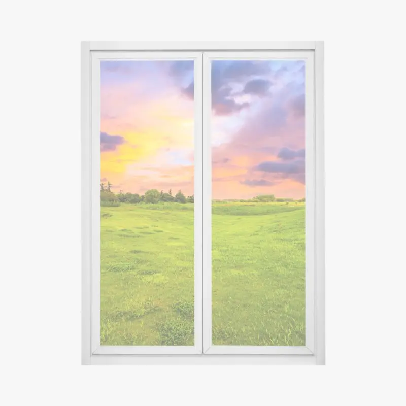 Fensteraufkleber sonnenuntergang über grüner wiese