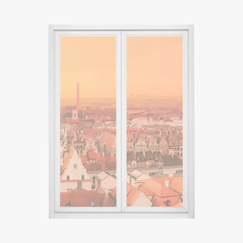Fensteraufkleber warmer sonnenuntergang über historischen stadtdächern