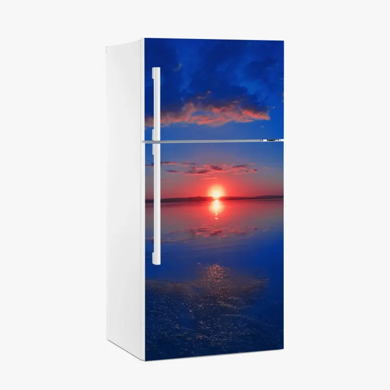 Kühlschrankaufkleber sonnenuntergang über ruhigem meer mit lebendiger spiegelung