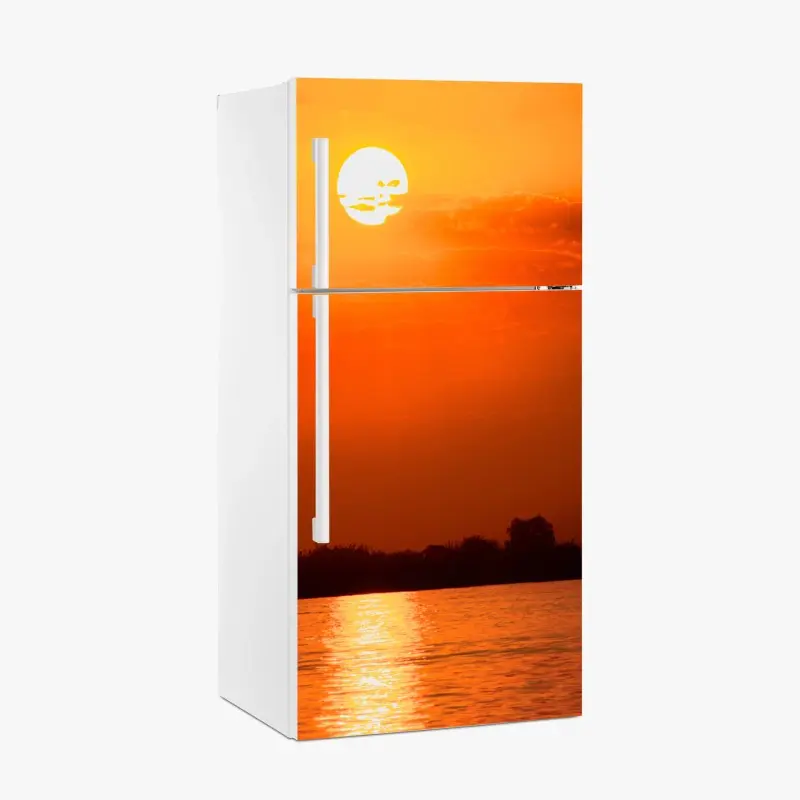 Kühlschrankaufkleber goldener sonnenuntergang über ruhigem see
