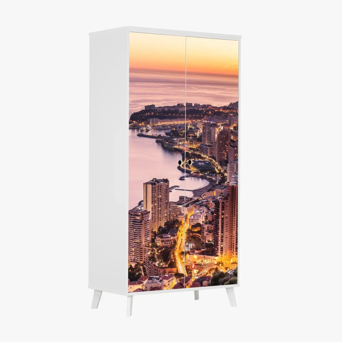 Schrankaufkleber sonnenuntergang über der städtischen küstenlinie – Pixers®