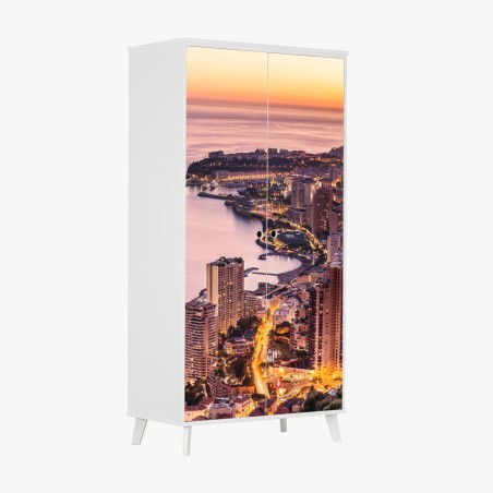 Schrankaufkleber sonnenuntergang über der städtischen küstenlinie – Pixers®