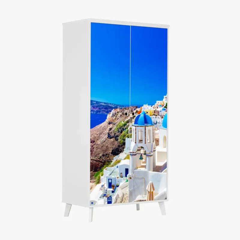 Schrankaufkleber Santorini blaue kuppeln über dem Ägäischen Meer