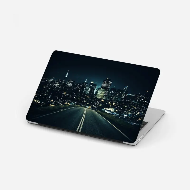 Laptop-Aufkleber straße zur beleuchteten stadtsilhouette bei nacht
