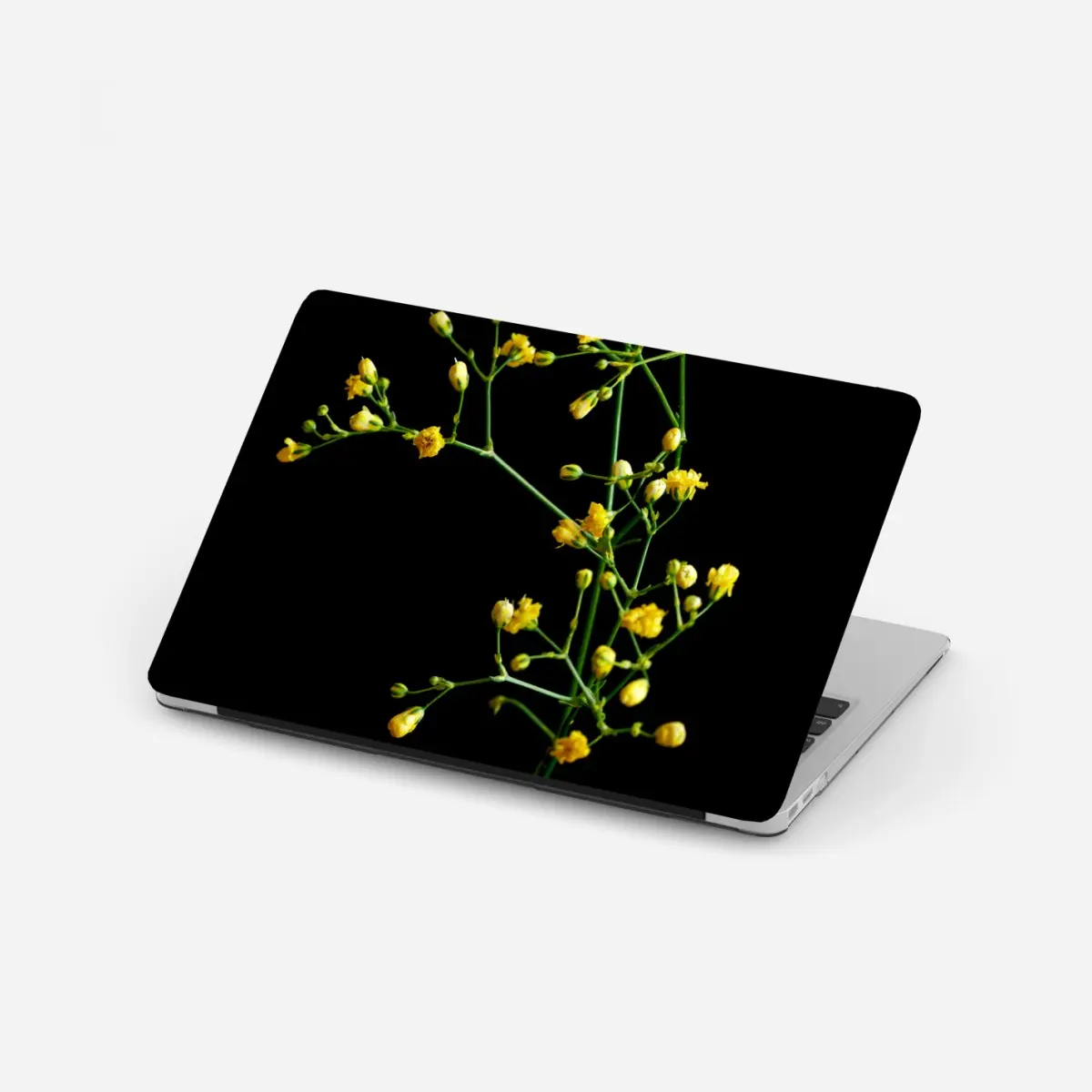 Laptop-Aufkleber zartes gelbes schleierkraut auf schwarzem hintergrund – Pixers®