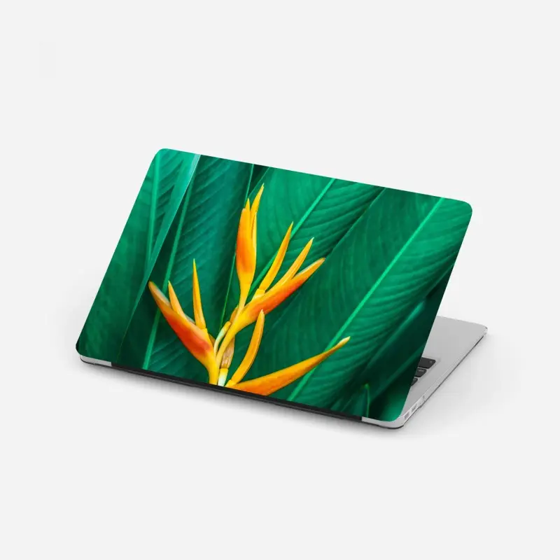 Laptop-Aufkleber leuchtende tropische paradiesvogelblume auf grünen blättern