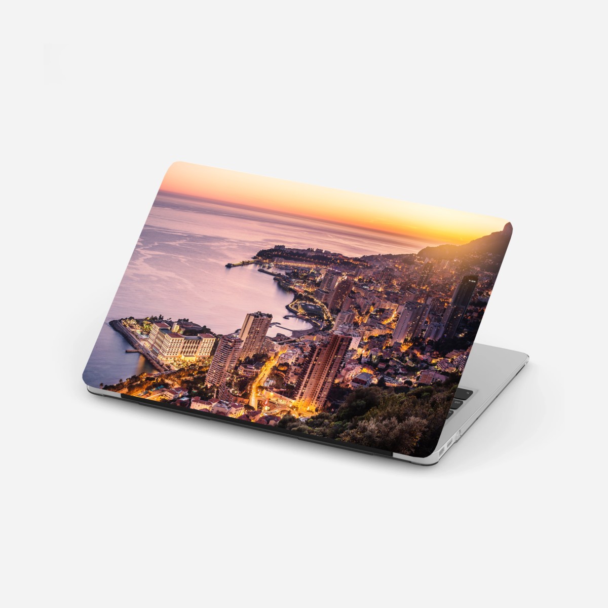 Laptop-Aufkleber sonnenuntergang über der städtischen küstenlinie – Pixers®