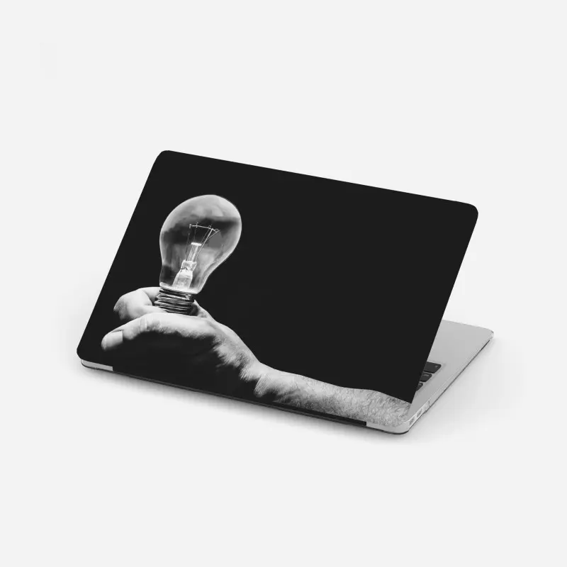 Laptop-Aufkleber monochrome hand hält glühbirne