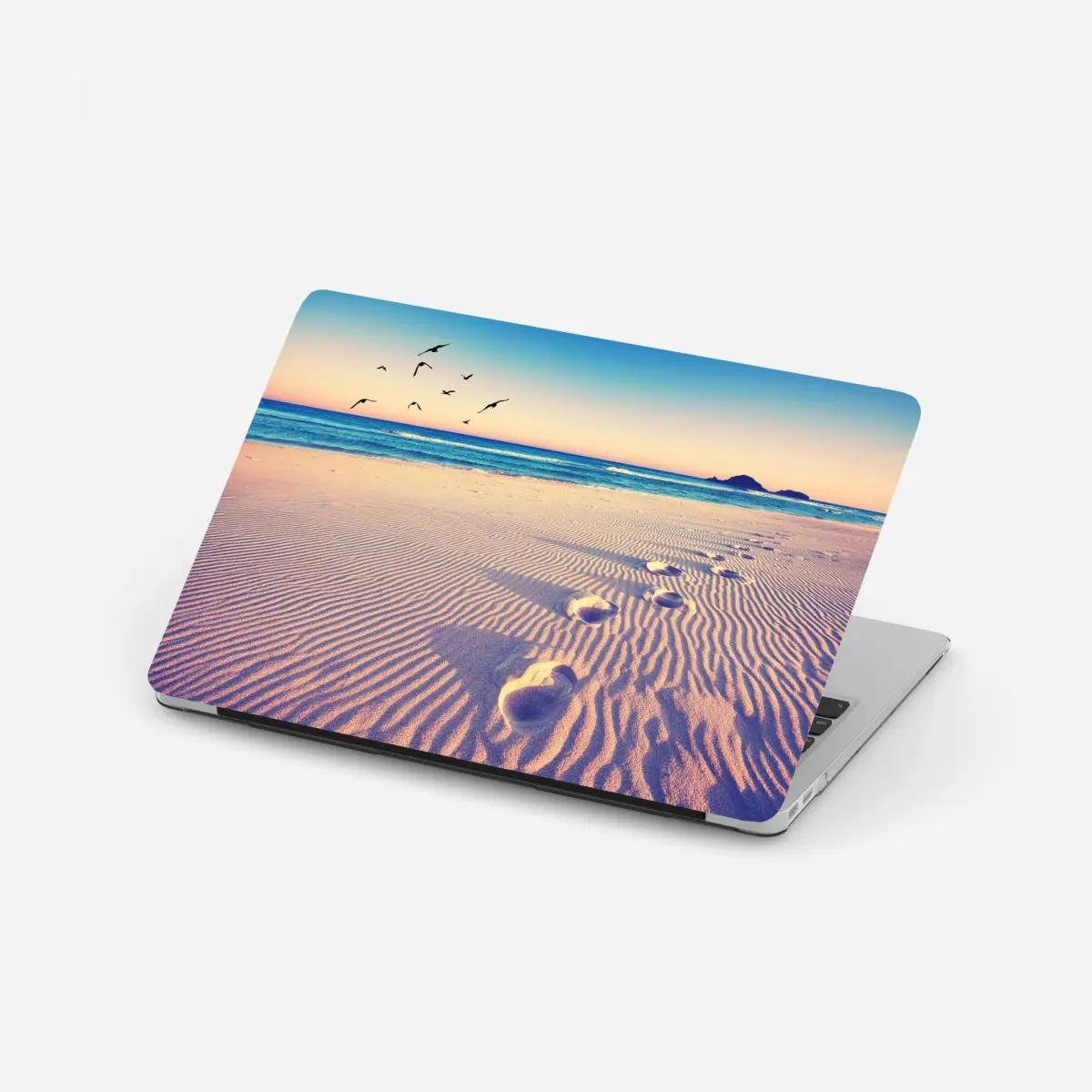 Laptop-Aufkleber magische fußspuren am sommerstrand – Pixers®