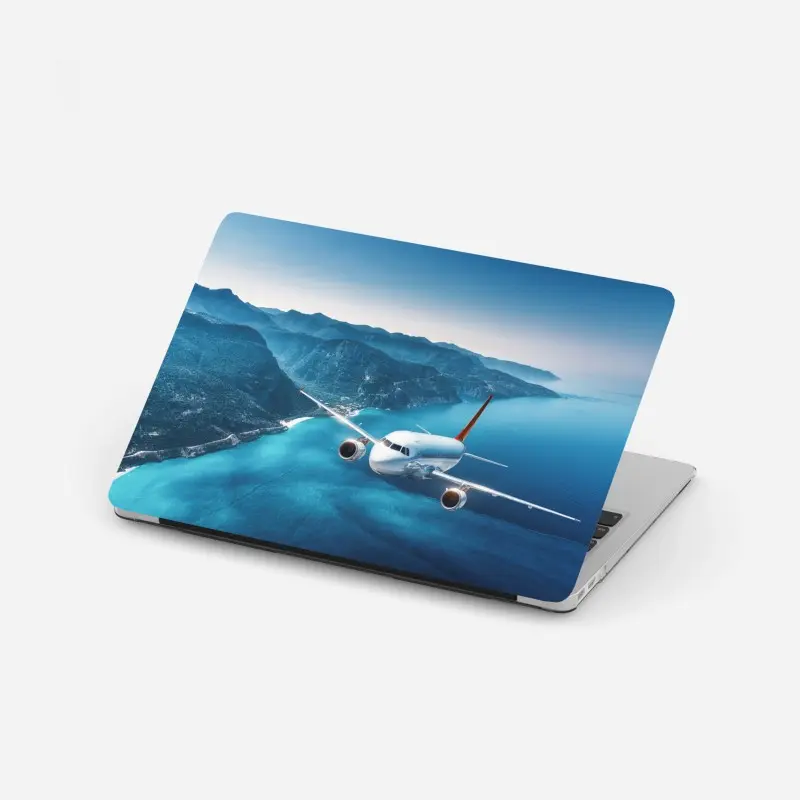 Laptop-Aufkleber küstenflug über türkisblauem meer