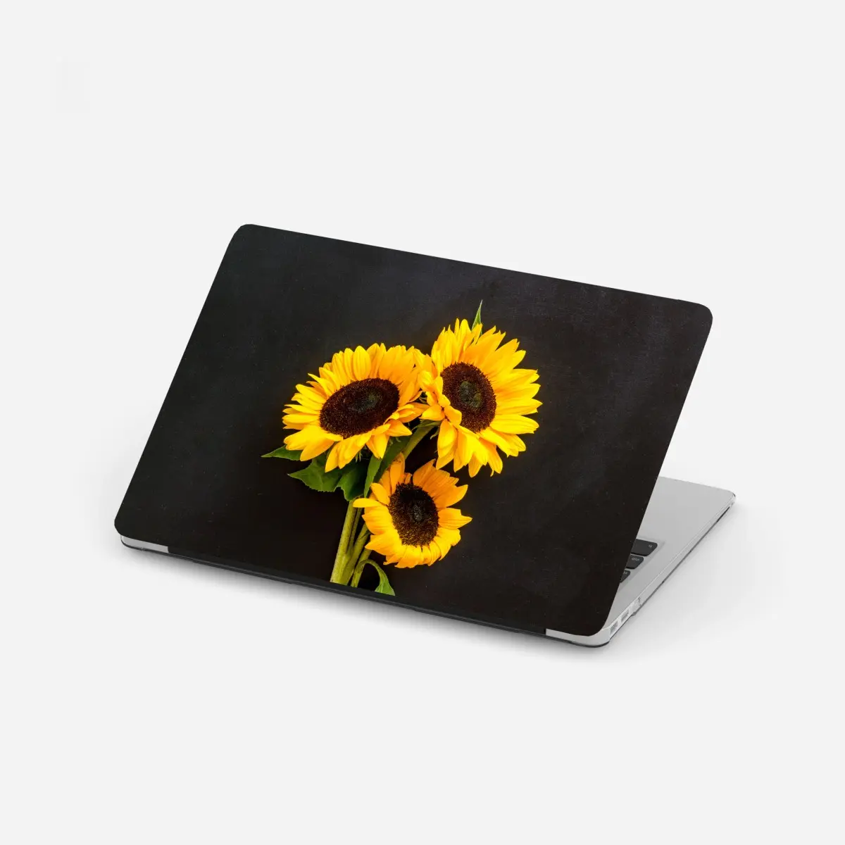 Laptop-Aufkleber leuchtende sonnenblumen auf schwarzem hintergrund – Pixers®