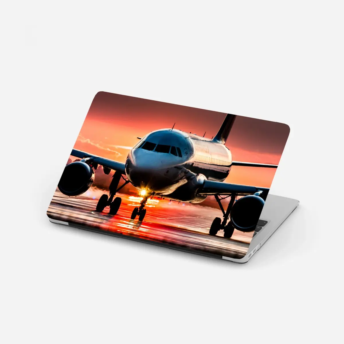 Laptop-Aufkleber jet im sonnenuntergang auf der startbahn – Pixers®