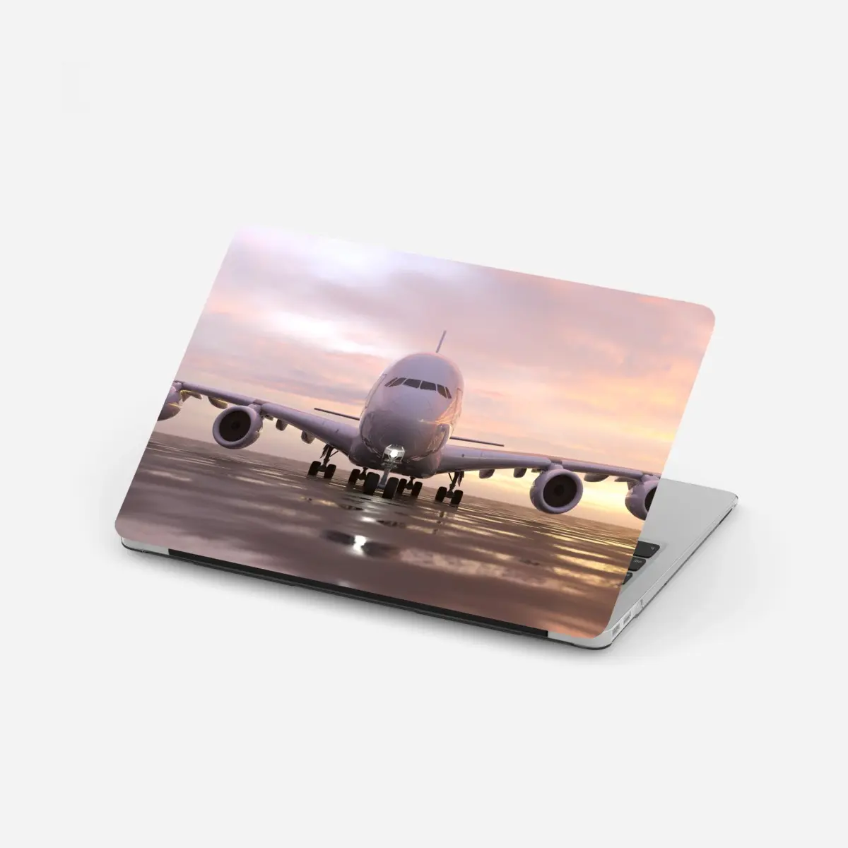 Laptop-Aufkleber jet auf der startbahn bei sonnenuntergang – Pixers®