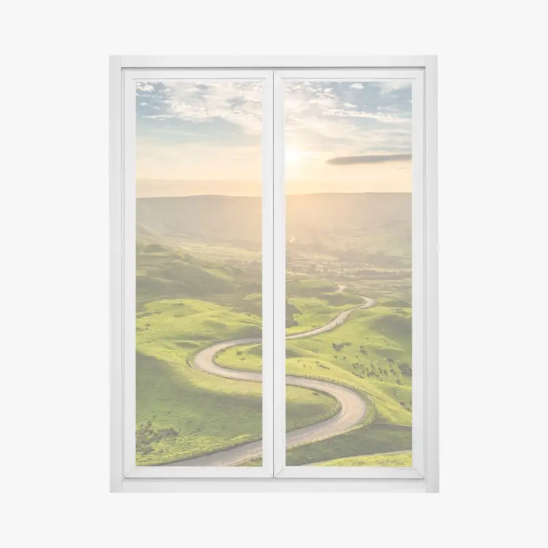 Fensteraufkleber goldener sonnenuntergang über einer geschwungenen landstraße