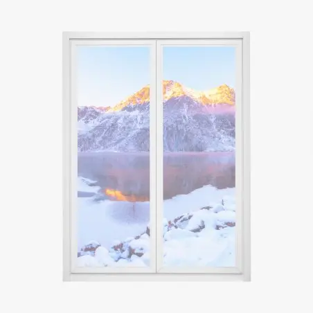 Fensteraufkleber sonnenbeschienene berge über gefrorenem alpensee – Pixers®