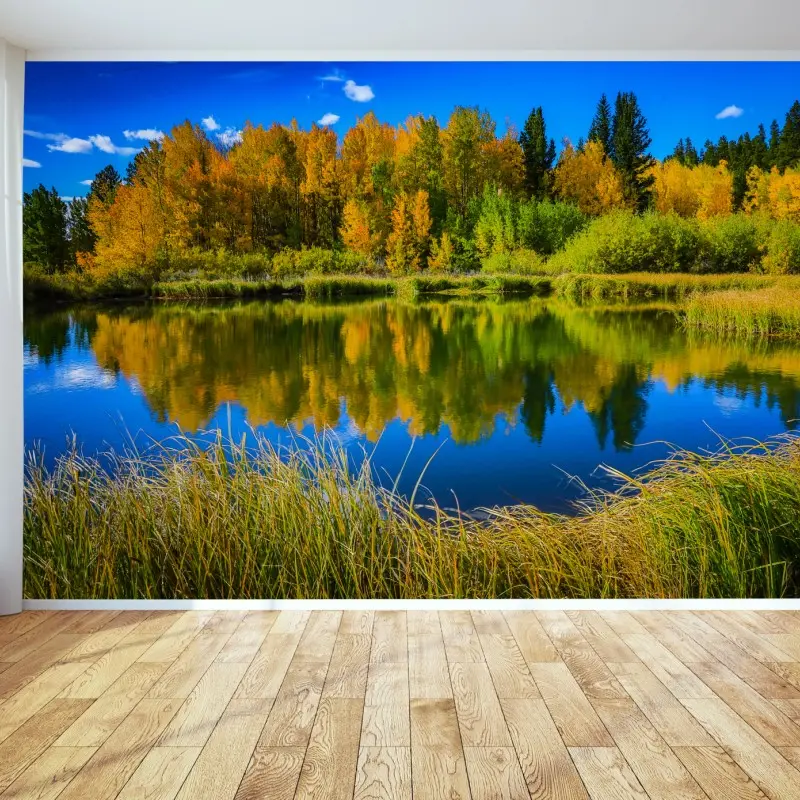 Fototapete herbstbäume spiegeln sich in einem ruhigen see