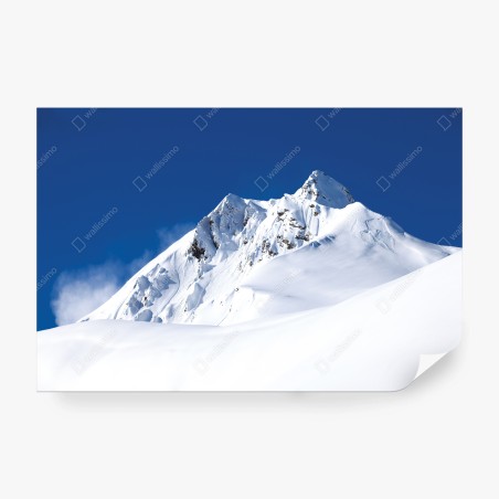 Fototapete verschneite alpenspitze unter tiefblauem himmel – Pixers®