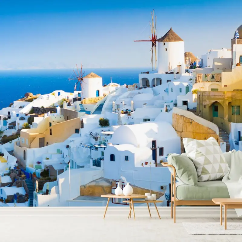 Fototapete sonnenbeschienenes Santorini-dorf am meer