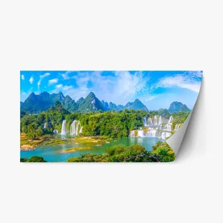 Repositionierbarer Aufkleber üppige panoramaansicht eines wasserfalls mit karstbergen – Pixers®