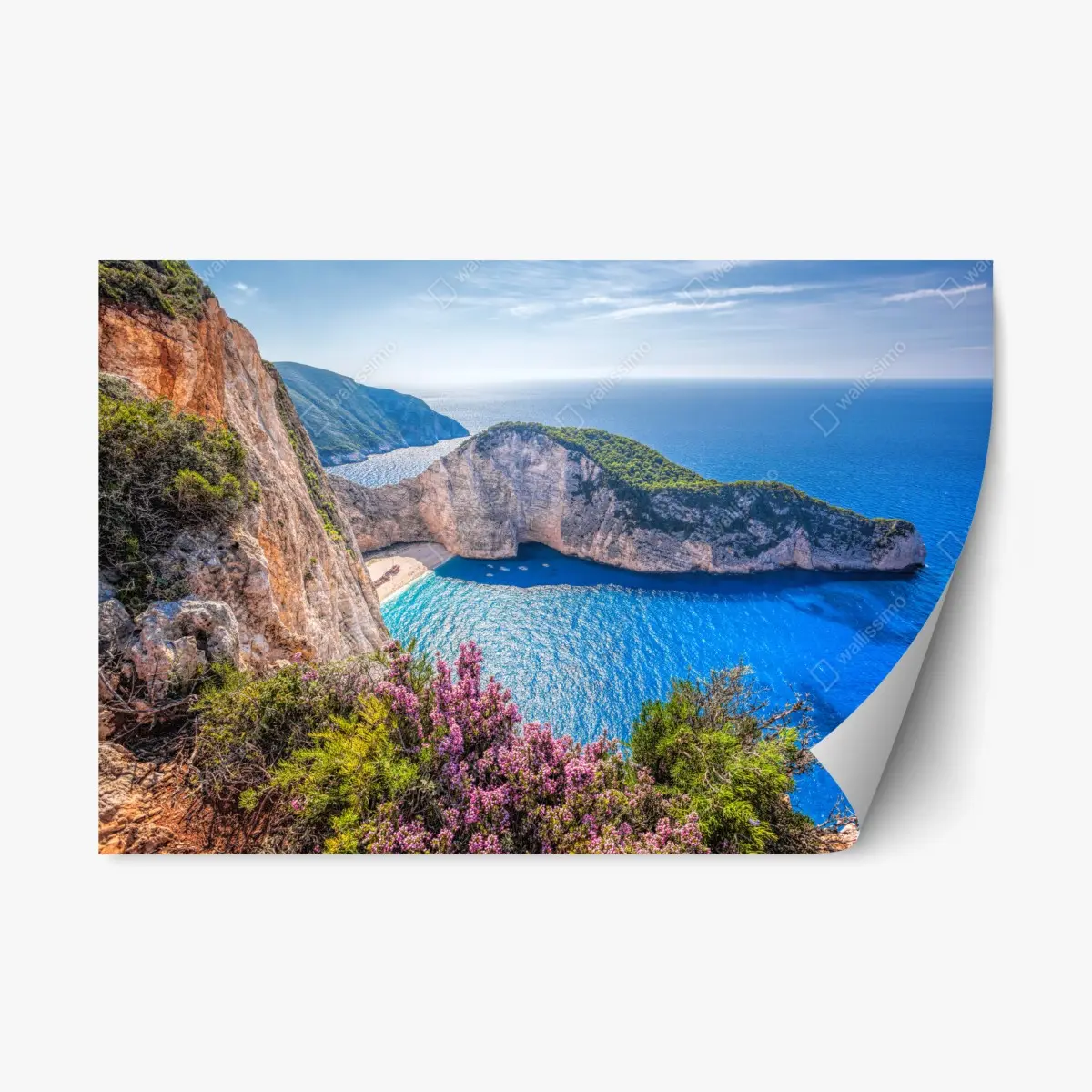 Repositionierbarer Aufkleber Navagio strand sonnenuntergang mit türkisblauem meer und wildblumen – Pixers®