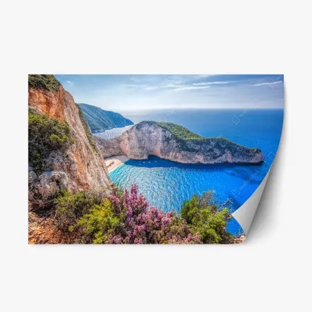 Repositionierbarer Aufkleber Navagio strand sonnenuntergang mit türkisblauem meer und wildblumen – Pixers®