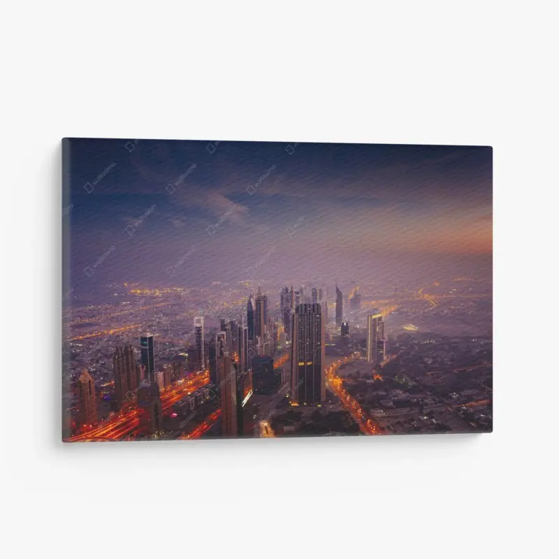 Leinwandbild abendliche stadtskyline mit leuchtenden lichtern