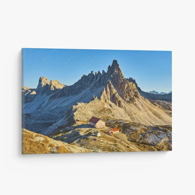 Leinwandbild goldene Alpen mit berghütte