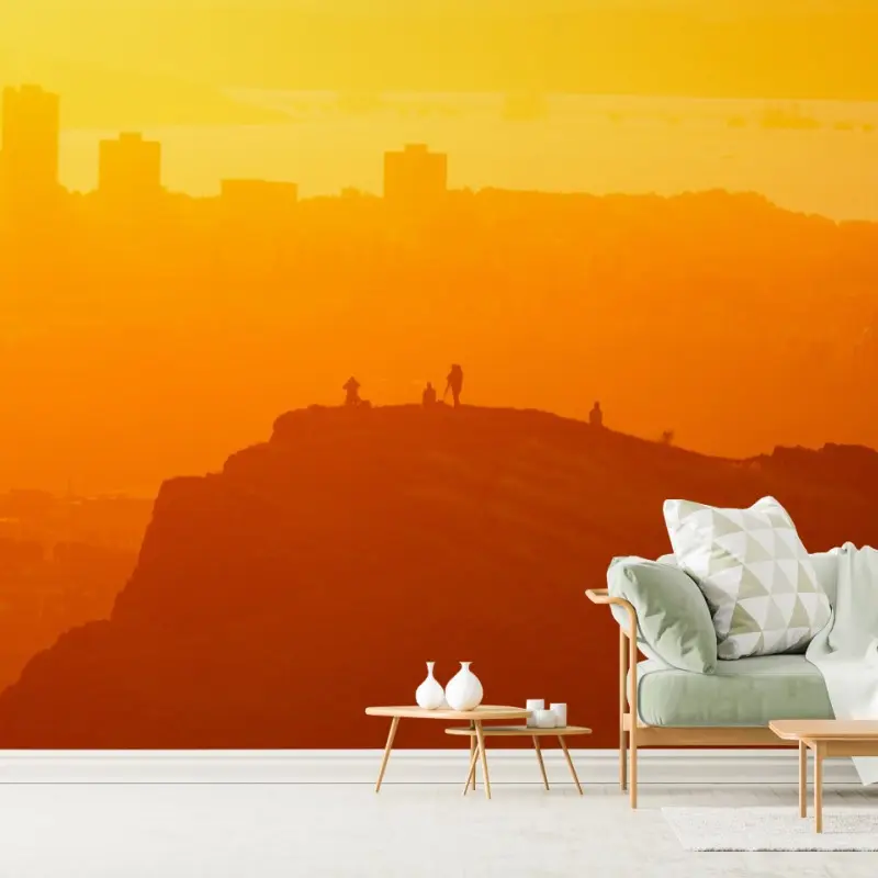 Fototapete goldene silhouette über klippen bei sonnenuntergang