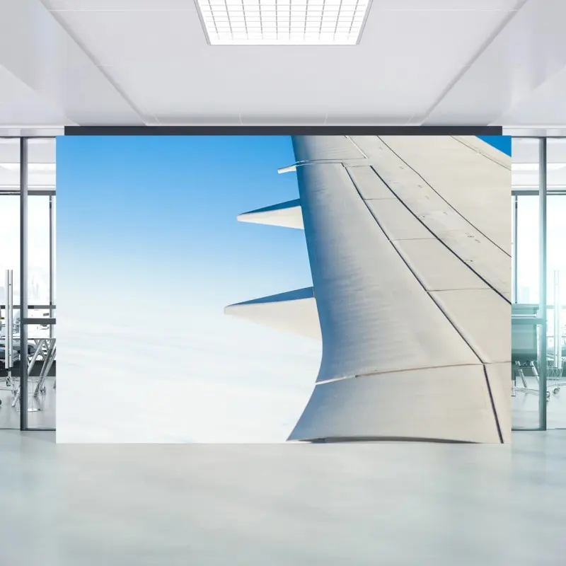 Fototapete flügel über den wolken im klaren blauen himmel
