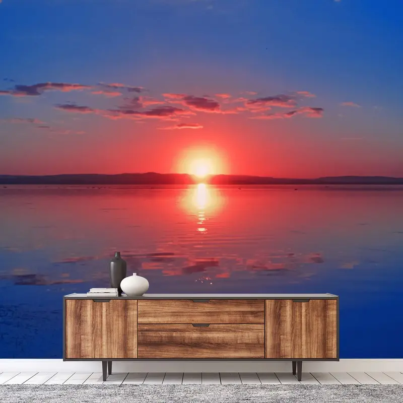 Fototapete sonnenuntergang über ruhigem meer mit lebendiger spiegelung