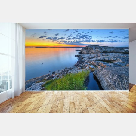Fototapete ruhiger küsten-sonnenuntergang über felsiger küste – Pixers®