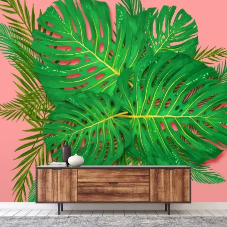 Fototapete monstera- und palmblätter vor rosa hintergrund