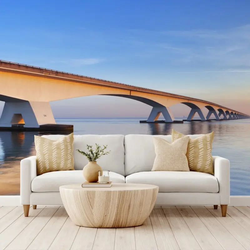 Fototapete Zeelandbrug bei sonnenaufgang über ruhiger see