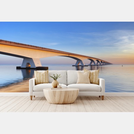 Fototapete Zeelandbrug bei sonnenaufgang über ruhiger see – Pixers®
