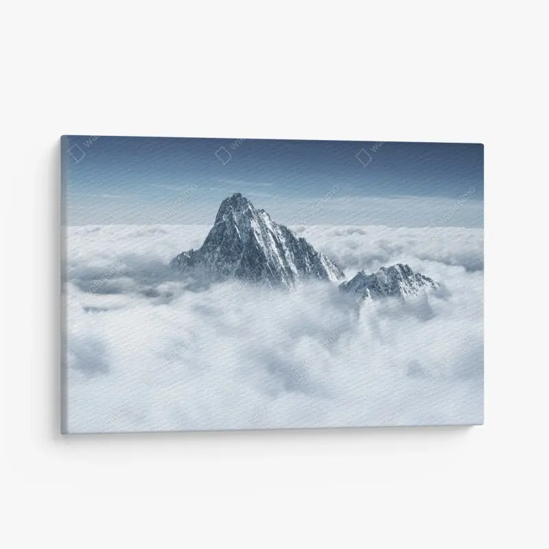 Leinwandbild verschneite gipfel über den wolken